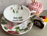 "Did that smell like almonds?" cup and saucer set, porcelain