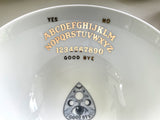 22k Gold Ouija with planchette Teacup and Saucer Set with Spoon, Porcelain. Holds 8 ounces.