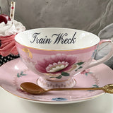"Train Wreck" teacup and saucer set with spoon, 8 ounces, porcelain