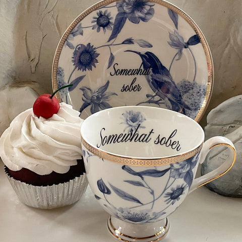 "Somewhat sober" teacup and saucer set with spoon, 7 ounces